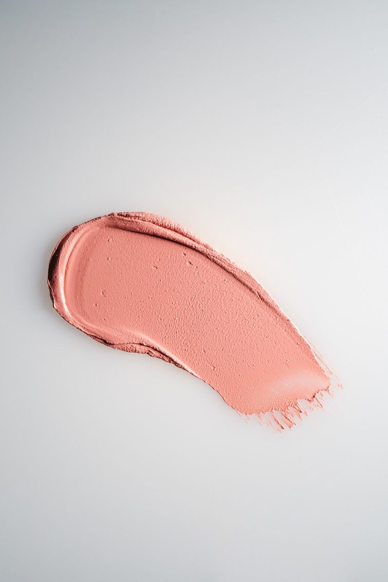 The Texture of Cream Blush on a White Background.