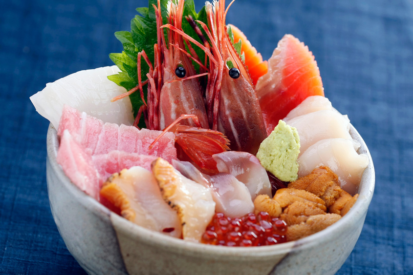 Bowl of rice topped with sashimi