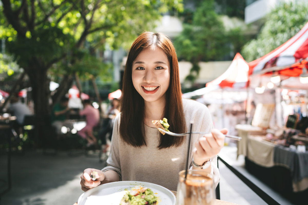 Asian Woman Eat Lunch Food at Restaurant Outdoors