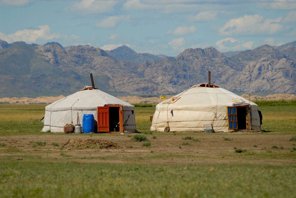 Two Mongolian yurts in steppe, Elsen Tasarhai valley, Mongolia.